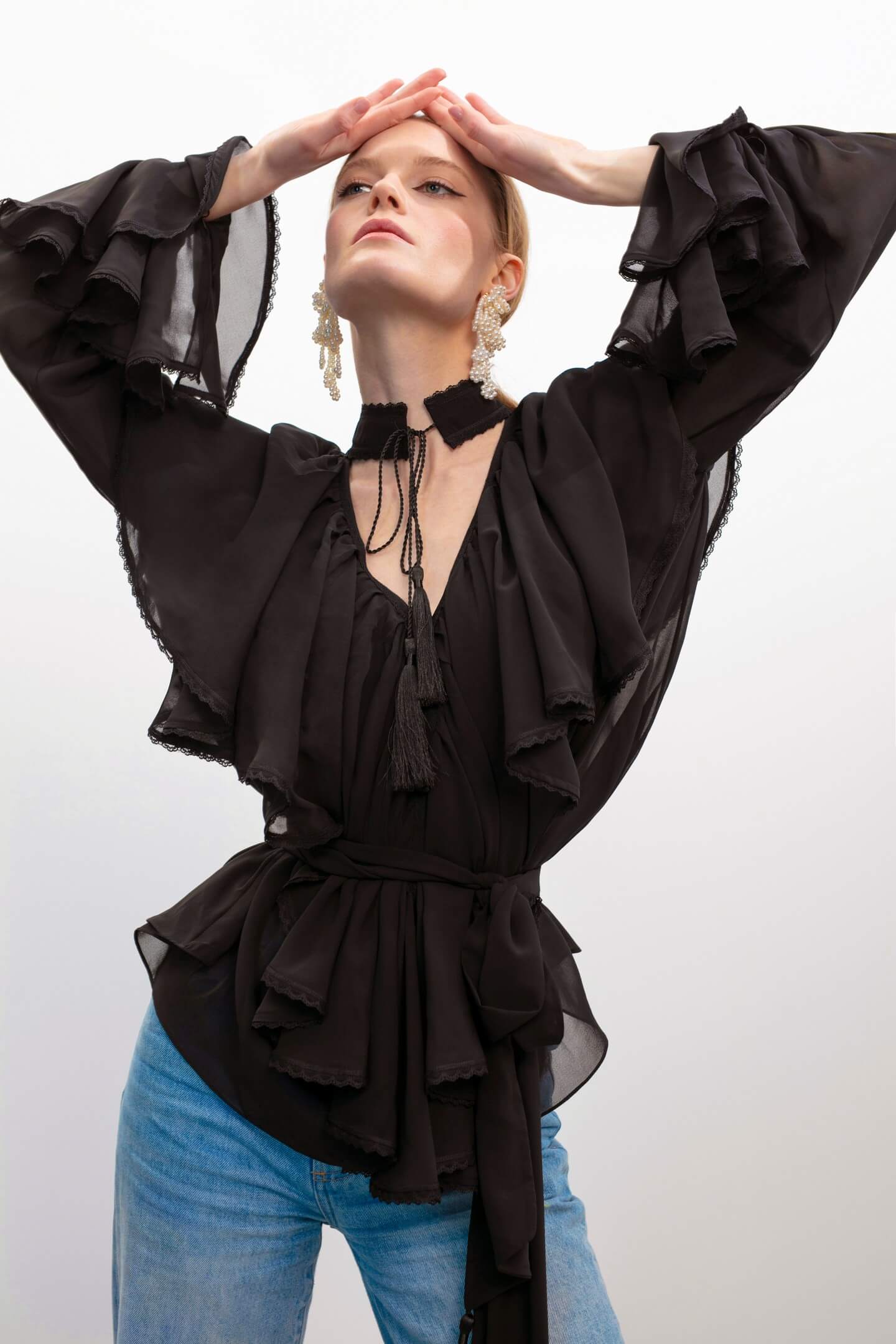 Model in Ocean Of Tenderness black blouse front view