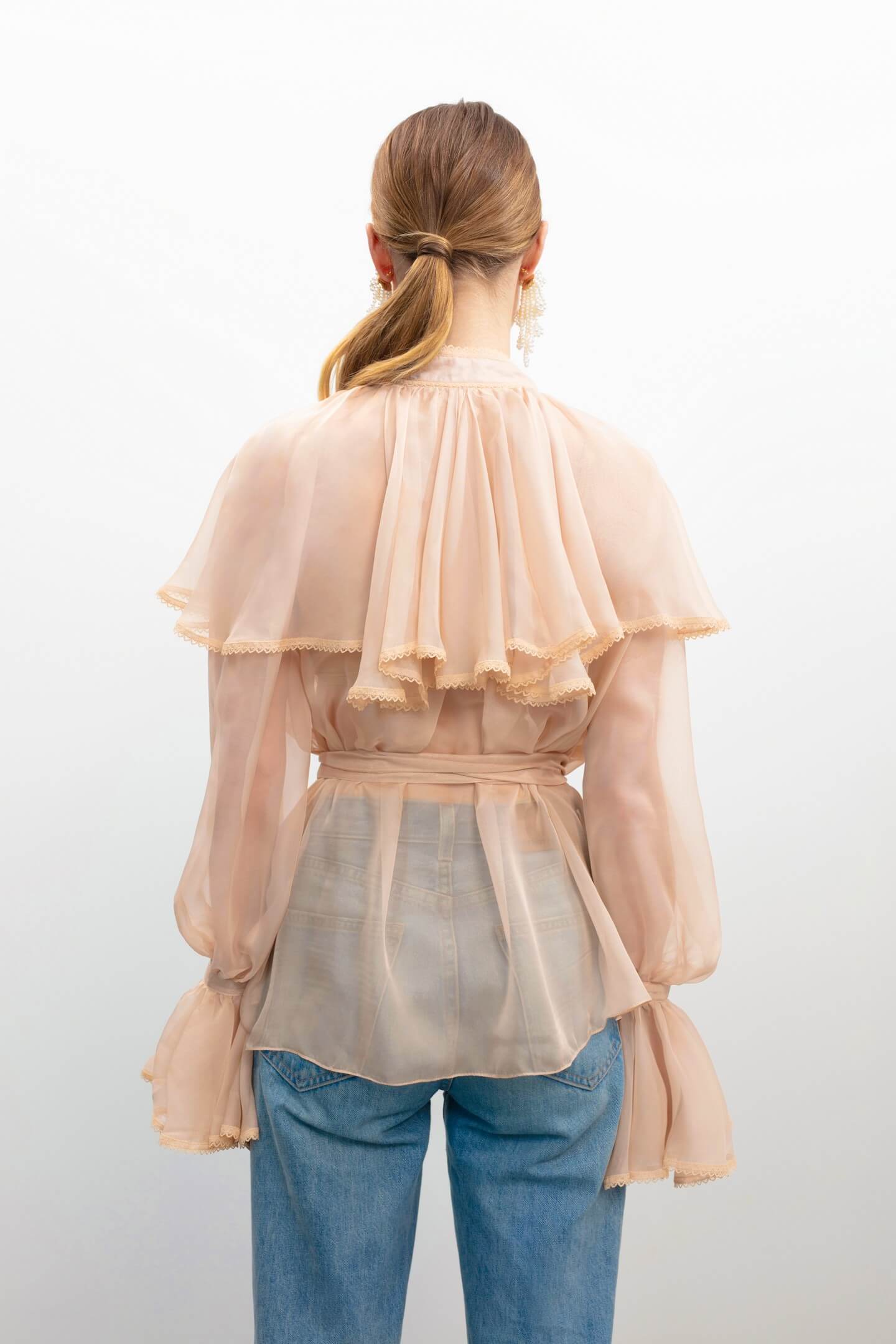 Model in Ocean Of Tenderness blouse back view